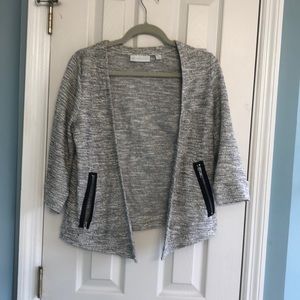 Grey cardigan with black zipper pockets